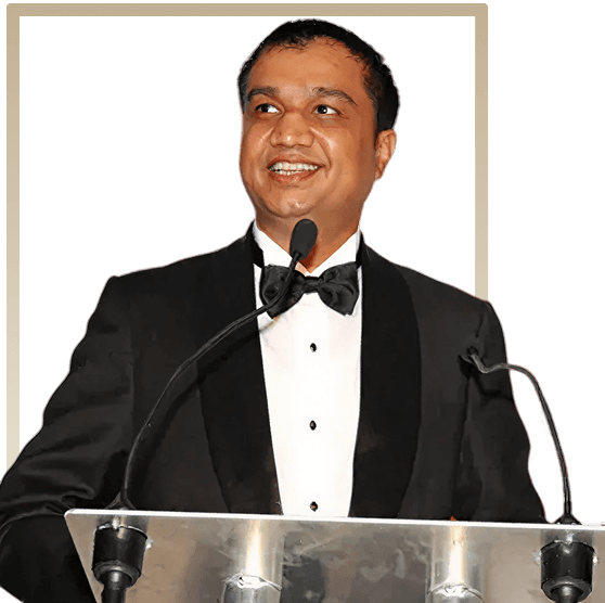 Arun Panchariya speaking at a podium